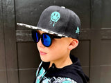 Black kids snapback hat with checkered brim and aqua drip smiley embroidery