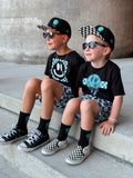Black kids snapback hat with checkered brim and aqua drip smiley embroidery