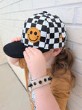 Kids checkered snapback hat with embroidered smiley in orange