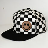 Kids checkered snapback hat with embroidered smiley in brown