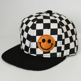 Kids checkered snapback hat with embroidered smiley in orange