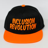 Kids snapback hat with INCLUSION REVOLUTION embroidered text supporting autism and special needs