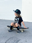 Black kids snapback hat with checkered brim and aqua drip smiley embroidery