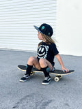 Black kids snapback hat with checkered brim and aqua drip smiley embroidery
